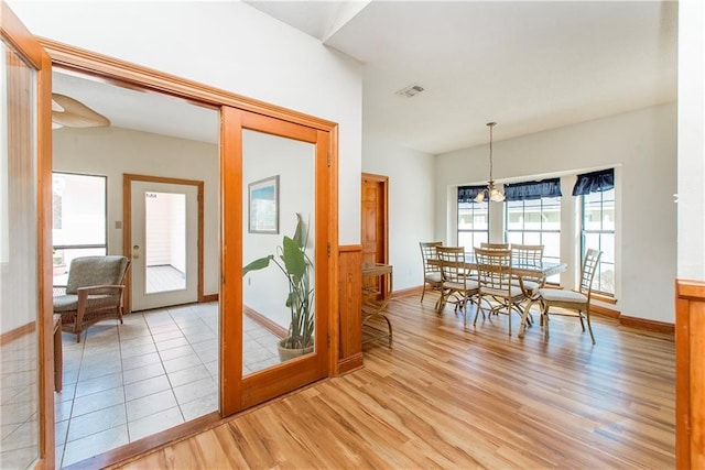 132 Country Club Dr, Covington, LA 70433 - dining space with light wood finished floors, baseboards, visible vents, and a chandelier