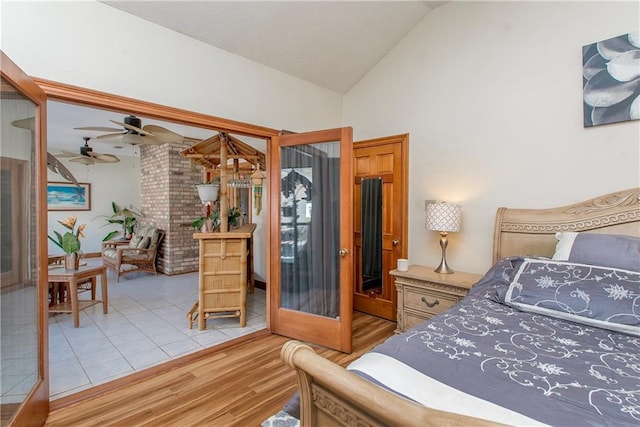 132 Country Club Dr, Covington, LA 70433 - bedroom featuring access to exterior, lofted ceiling, and wood finished floors