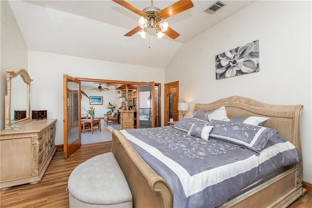 132 Country Club Dr, Covington, LA 70433 - bedroom with access to exterior, vaulted ceiling, light wood finished floors, visible vents, and ceiling fan