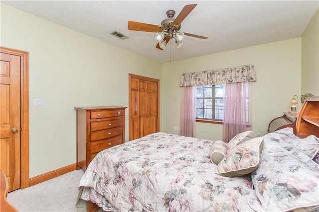 132 Country Club Dr, Covington, LA 70433 - bedroom with a closet, visible vents, baseboards, ceiling fan, and carpet floors