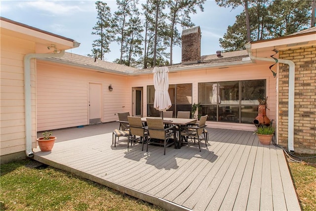 132 Country Club Dr, Covington, LA 70433 - wooden terrace featuring outdoor dining space