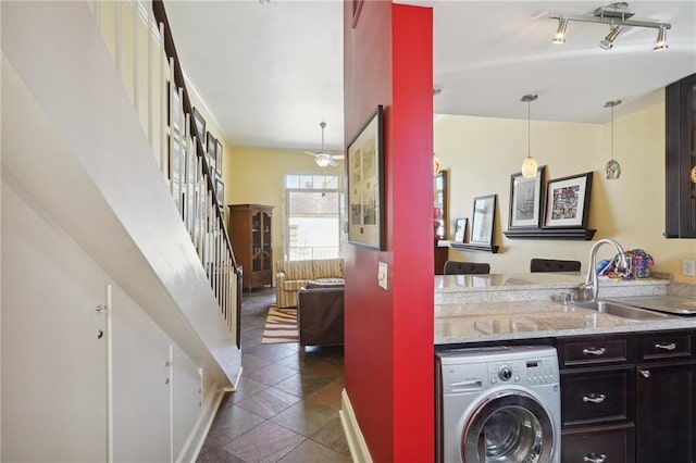 1040 Chartres St Unit D9, New Orleans, LA 70116 - clothes washing area with washer / dryer and baseboards
