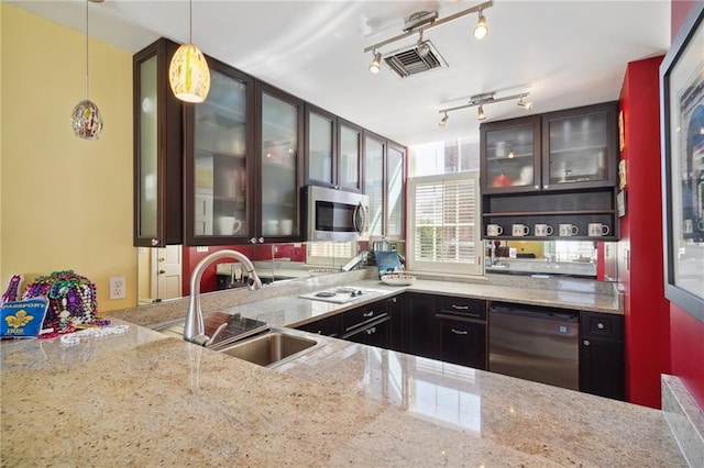 1040 Chartres St Unit D9, New Orleans, LA 70116 - kitchen featuring a sink, stainless steel microwave, dishwasher, light stone counters, and white electric stovetop