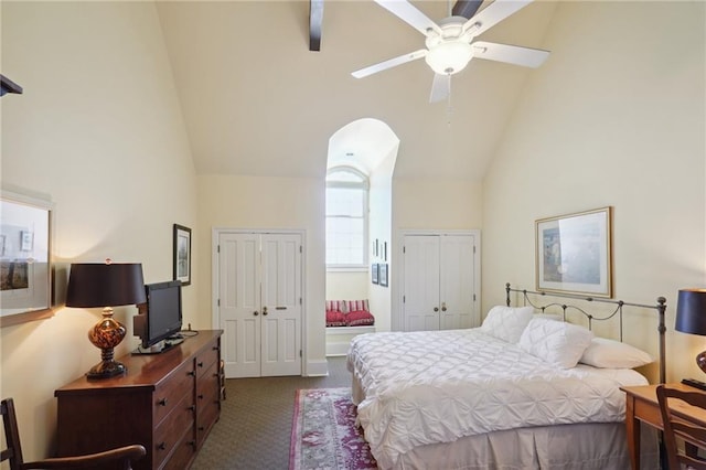 1040 Chartres St Unit D9, New Orleans, LA 70116 - bedroom with multiple closets, high vaulted ceiling, dark carpet, and ceiling fan