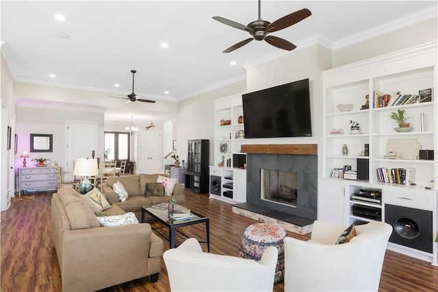 109 Moonlight Cove Ln, Luling, LA 70070 - living room with a ceiling fan, a fireplace with raised hearth, dark wood-style floors, recessed lighting, and ornamental molding