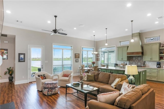 109 Moonlight Cove Ln, Luling, LA 70070 - living room featuring dark wood-style floors, recessed lighting, a ceiling fan, and crown molding
