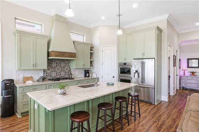 109 Moonlight Cove Ln, Luling, LA 70070 - kitchen featuring appliances with stainless steel finishes, green cabinets, premium range hood, dark wood-type flooring, and ornamental molding