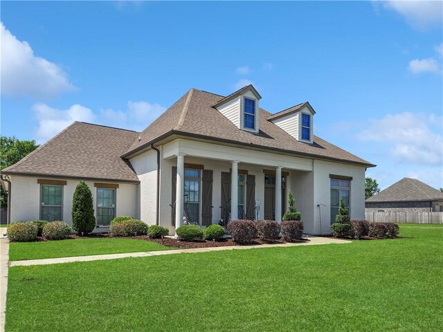 531 N Caleb Dr, Slidell, LA 70461 - rear view of property featuring a shingled roof, stucco siding, and covered porch