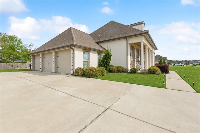 531 N Caleb Dr, Slidell, LA 70461 - view of home's exterior featuring driveway, a yard, and a shingled roof