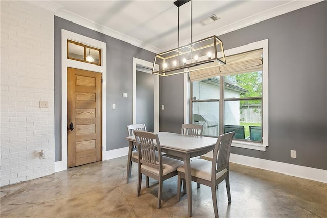 531 N Caleb Dr, Slidell, LA 70461 - dining area featuring finished concrete floors, a chandelier, baseboards, and ornamental molding