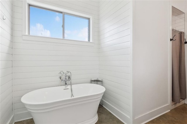 531 N Caleb Dr, Slidell, LA 70461 - full bathroom featuring a soaking tub, wood walls, and a shower