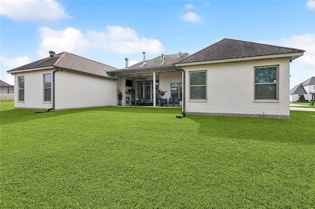 531 N Caleb Dr, Slidell, LA 70461 - rear view of house with a yard, a shingled roof, and a patio