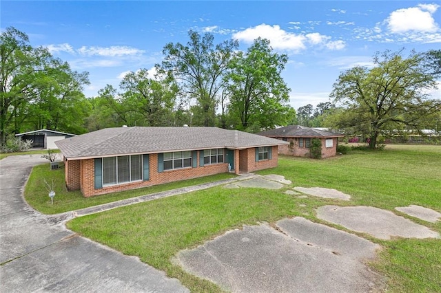 47116 N Morrison Blvd, Hammond, LA 70401 - view of front of home featuring brick siding, driveway, and a front yard