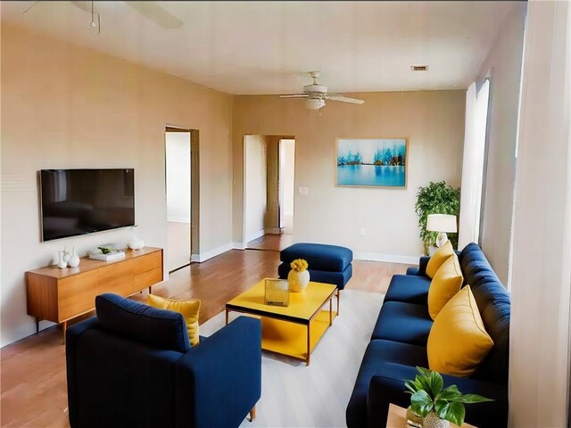 313840 Louisiana Ave Parkway, New Orleans, LA 70125 - living room with a ceiling fan, wood finished floors, and baseboards