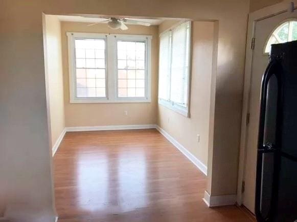 313840 Louisiana Ave Parkway, New Orleans, LA 70125 - unfurnished dining area with wood finished floors, ceiling fan, and baseboards