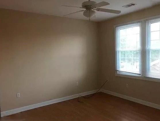 313840 Louisiana Ave Parkway, New Orleans, LA 70125 - unfurnished room featuring ceiling fan, wood finished floors, and baseboards