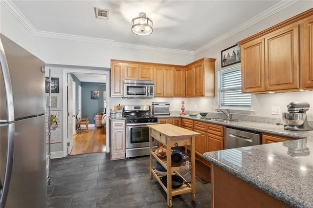 4718 Annette St, New Orleans, LA 70122 - kitchen featuring a sink, appliances with stainless steel finishes, crown molding, and visible vents