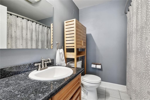 4718 Annette St, New Orleans, LA 70122 - bathroom with tile patterned flooring, vanity, toilet, a shower with shower curtain, and baseboards