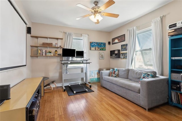 4718 Annette St, New Orleans, LA 70122 - living room with baseboards, light wood-style floors, and ceiling fan