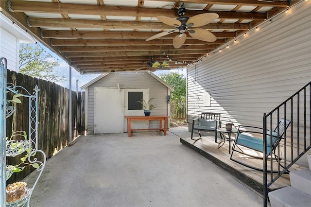 4718 Annette St, New Orleans, LA 70122 - view of patio / terrace with an outbuilding, fence, a storage shed, and ceiling fan