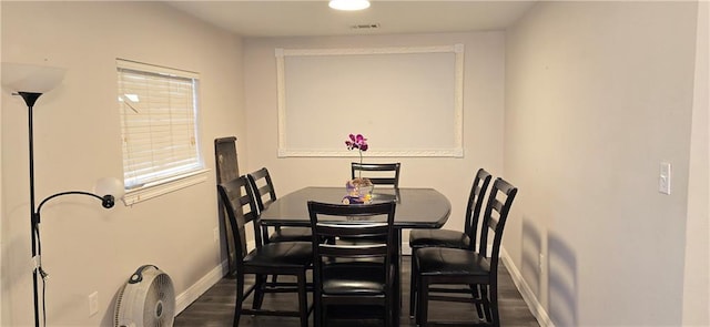 2713 Volpe Dr, Chalmette, LA 70043 - dining room featuring baseboards, visible vents, and dark wood-style flooring