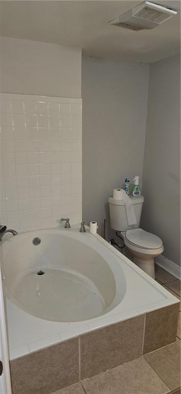2713 Volpe Dr, Chalmette, LA 70043 - full bathroom with a bath, visible vents, toilet, and tile patterned floors