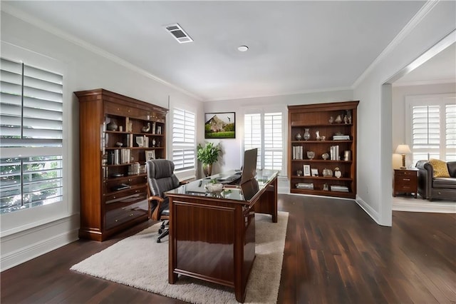 office area featuring dark wood-type flooring, crown molding, visible vents, and plenty of natural light