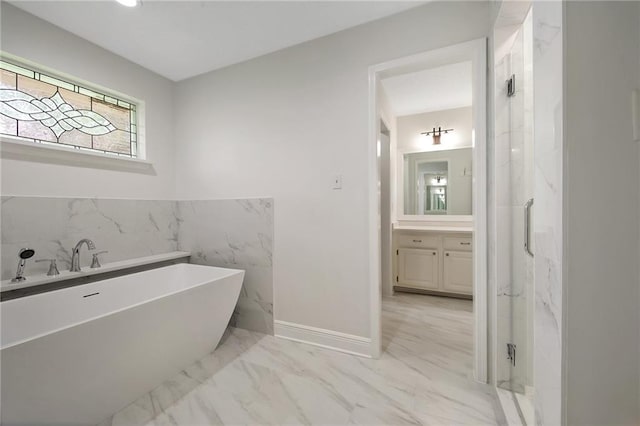 full bathroom with a soaking tub, marble finish floor, vanity, and a marble finish shower