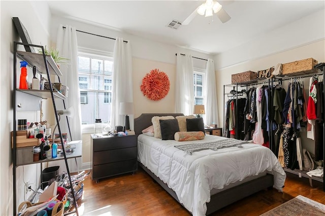 710 Burdette St, New Orleans, LA 70118 - bedroom with visible vents, a closet, wood finished floors, and ceiling fan
