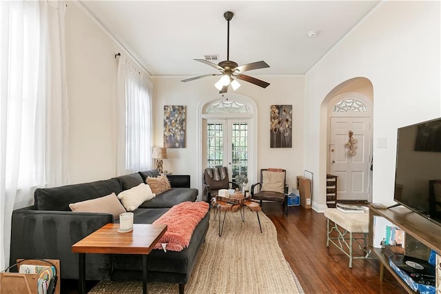 710 Burdette St, New Orleans, LA 70118 - living area with visible vents, crown molding, ceiling fan, wood finished floors, and arched walkways