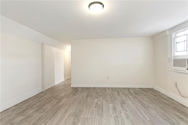 710 Burdette St, New Orleans, LA 70118 - spare room with baseboards and light wood-style flooring