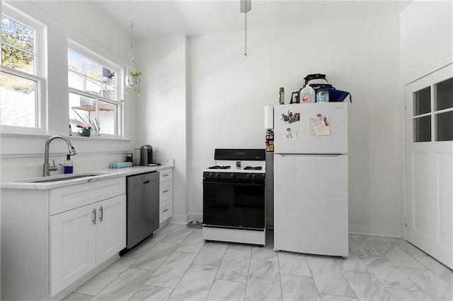 710 Burdette St, New Orleans, LA 70118 - kitchen featuring light countertops, a sink, marble finish floor, white appliances, and white cabinets