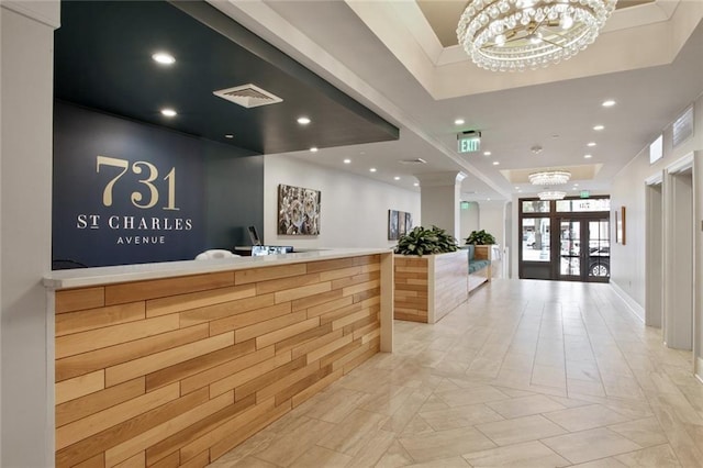 reception with visible vents and a notable chandelier
