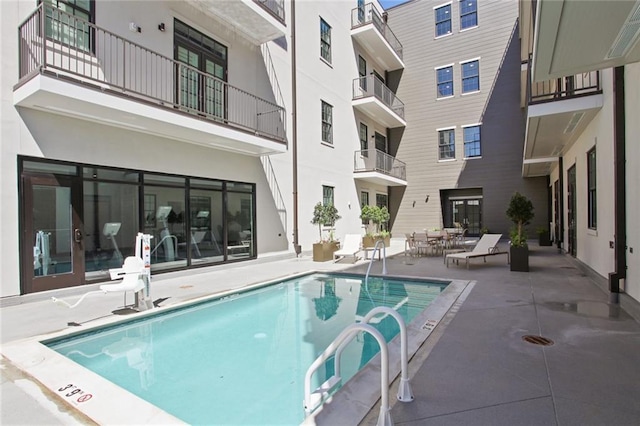 community pool with a patio