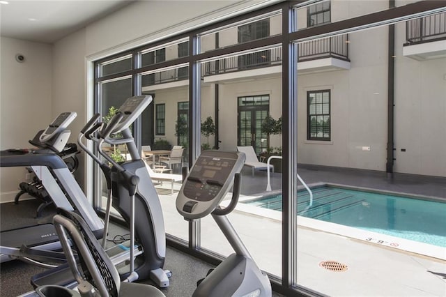 exercise room with baseboards
