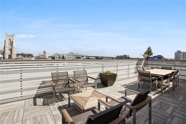 wooden terrace with outdoor dining area