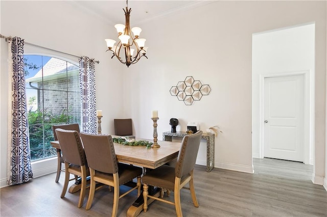 227 Riverlands Dr, La Place, LA 70068 - dining area with a chandelier, plenty of natural light, wood finished floors, and crown molding