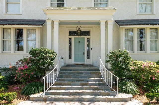 119 Audubon Blvd, New Orleans, LA 70118 - view of exterior entry featuring stucco siding