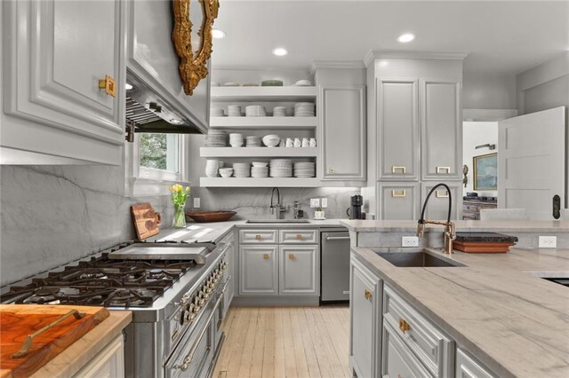 119 Audubon Blvd, New Orleans, LA 70118 - kitchen featuring a sink, dishwasher, open shelves, range, and recessed lighting