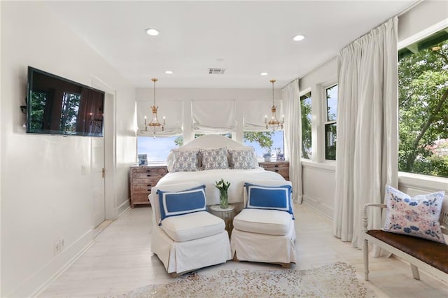 119 Audubon Blvd, New Orleans, LA 70118 - bedroom with a chandelier, recessed lighting, light wood-style flooring, and baseboards