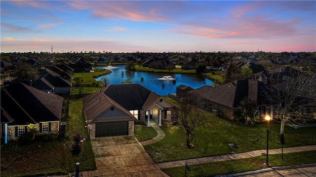 313 Oak Point Dr, La Place, LA 70068 - aerial view at dusk of a water view and a residential view