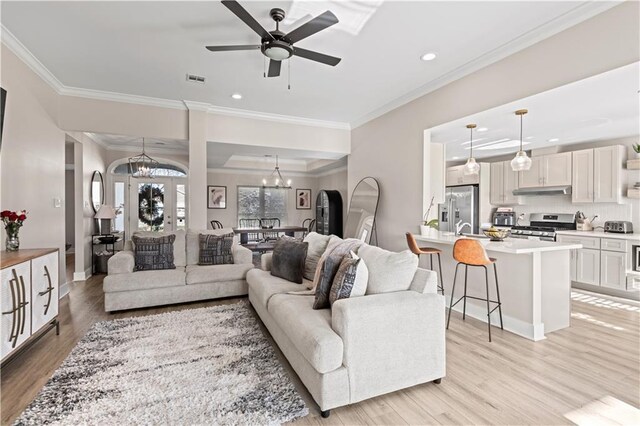313 Oak Point Dr, La Place, LA 70068 - living room with a chandelier, light wood-style floors, crown molding, recessed lighting, and ceiling fan