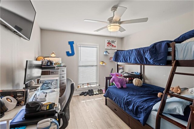 313 Oak Point Dr, La Place, LA 70068 - bedroom with wood finished floors and a ceiling fan