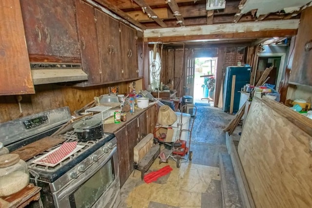 313 N Bengal Rd, Metairie, LA 70003 - kitchen with stainless steel gas stove and under cabinet range hood