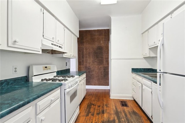 kitchen featuring white cabinetry, dark wood-style floors, under cabinet range hood, and white appliances