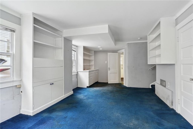 interior space with dark colored carpet