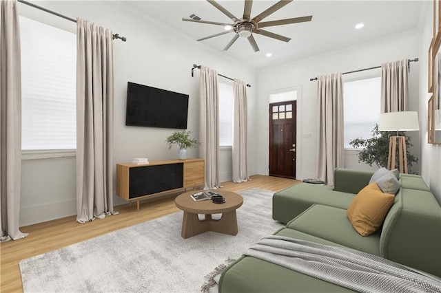 2460 N Villere St, New Orleans, LA 70117 - living room with ceiling fan, wood finished floors, crown molding, baseboards, and recessed lighting