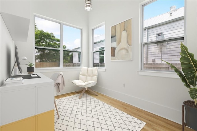 2460 N Villere St, New Orleans, LA 70117 - sitting room with healthy amount of natural light, light wood-type flooring, and baseboards