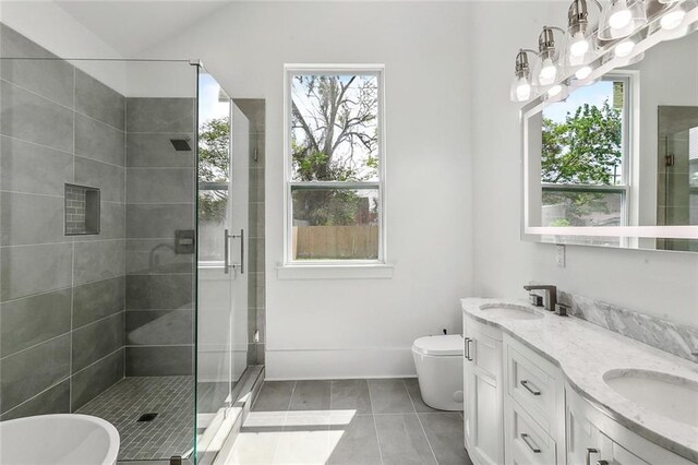 2460 N Villere St, New Orleans, LA 70117 - full bath with a stall shower, toilet, tile patterned flooring, and double vanity