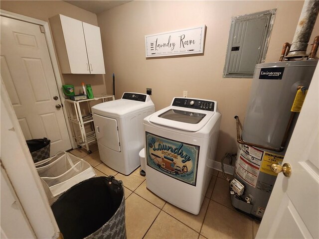 laundry room featuring water heater, washer and clothes dryer, light tile patterned floors, cabinet space, and electric panel